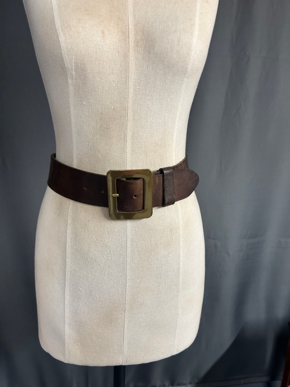 Chunky leather belt with statement square brass buckle. Size S-M